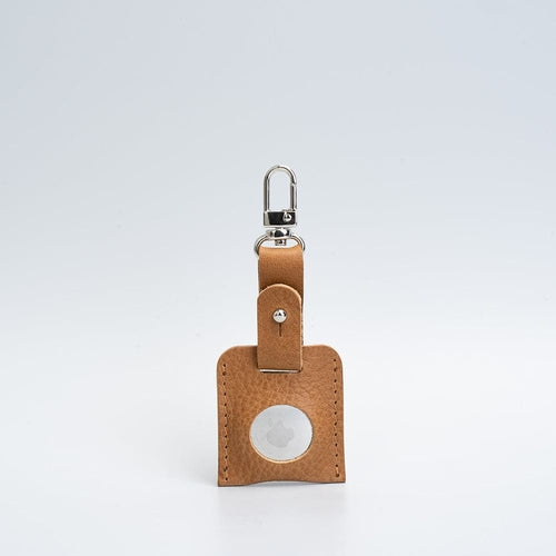 Leather AirTag bag charm with carabiner.
