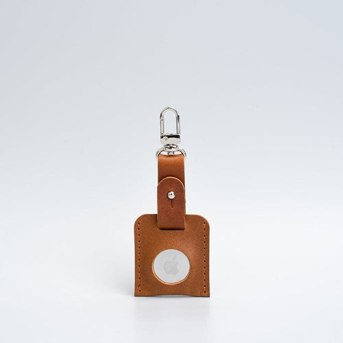 Leather AirTag bag charm with carabiner.